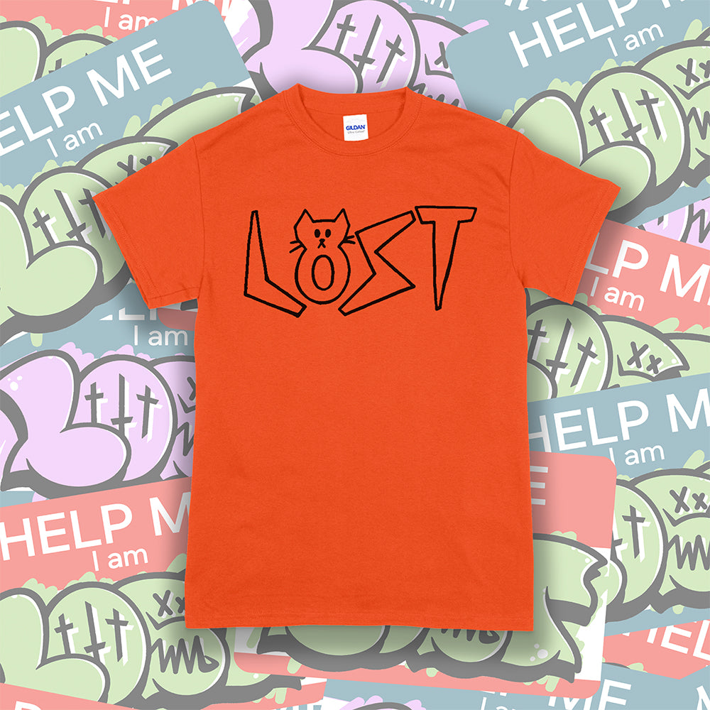 Charlottes Black Cat Letters. Hand drawn design of cat shaped letters. Drawn by my daughter Charlotte, and printed with black ink on an orange cotton shirt. Lots of cool stickers in the background.