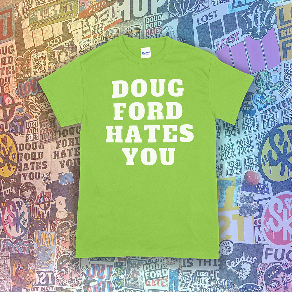 The original Doug Ford Hates You t-shirt. Bold white letters screen printed on a lime green shirt. Colorful graffiti stickers make up the background.