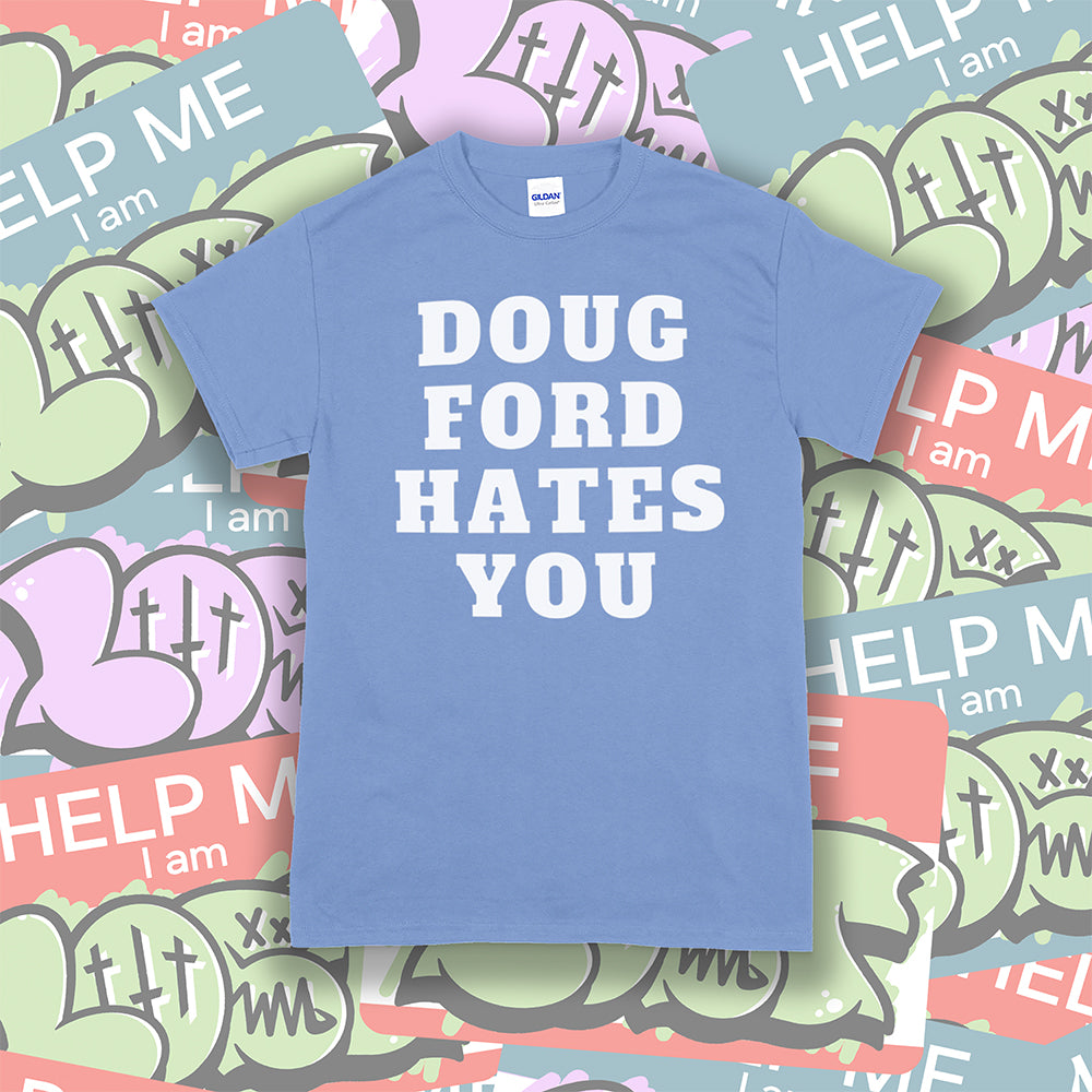 The original Doug Ford Hates You t-shirt. Bold white letters screen printed on a light blue shirt. Colorful graffiti stickers make up the background.