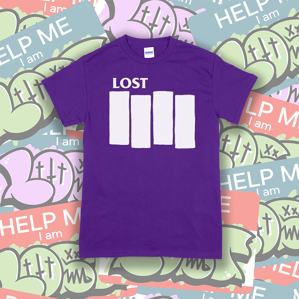 The Lost Flag t-shirt. The iconic bold logo is screen printed in white ink on a purple cotton shirt. A collection of colorful graffiti stickers make up the background.