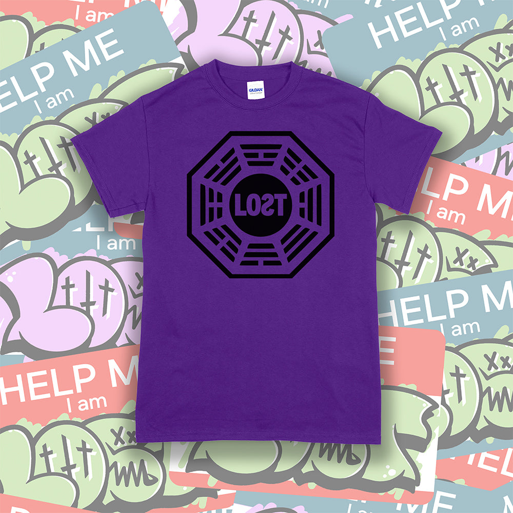 The Lost Initiative t-shirt by Lost Streetwear. The bold black logo is screen printed on a deep purple shirt. A wall of brightly colored graffiti stickers make up the background.