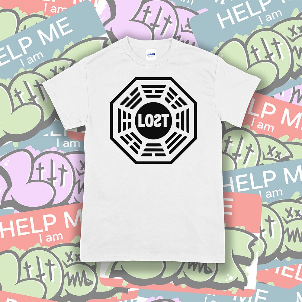 The Lost Initiative t-shirt by Lost Streetwear. The bold black logo is screen printed on a crisp white shirt. A wall of brightly colored graffiti stickers make up the background.