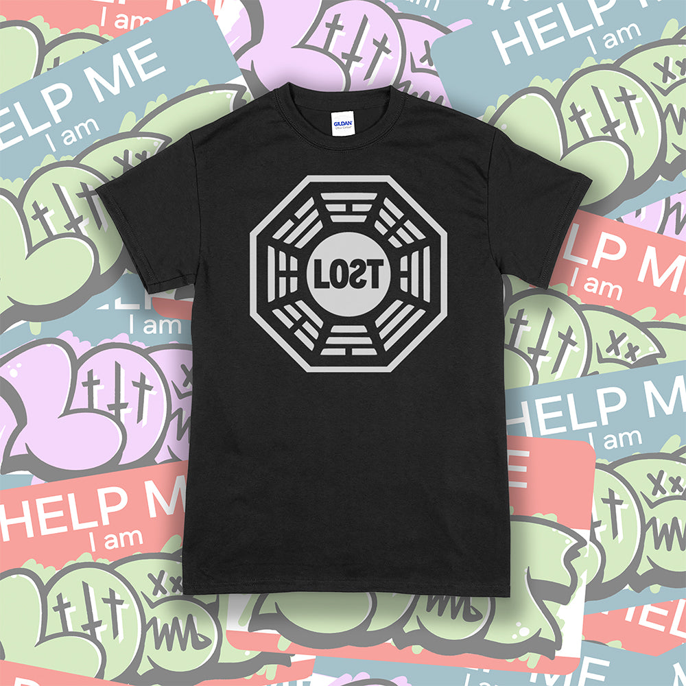 The Lost Initiative t-shirt with a large solid white logo screen printed on a black shirt. A collection of colorful LOST graffiti stickers make up the background.