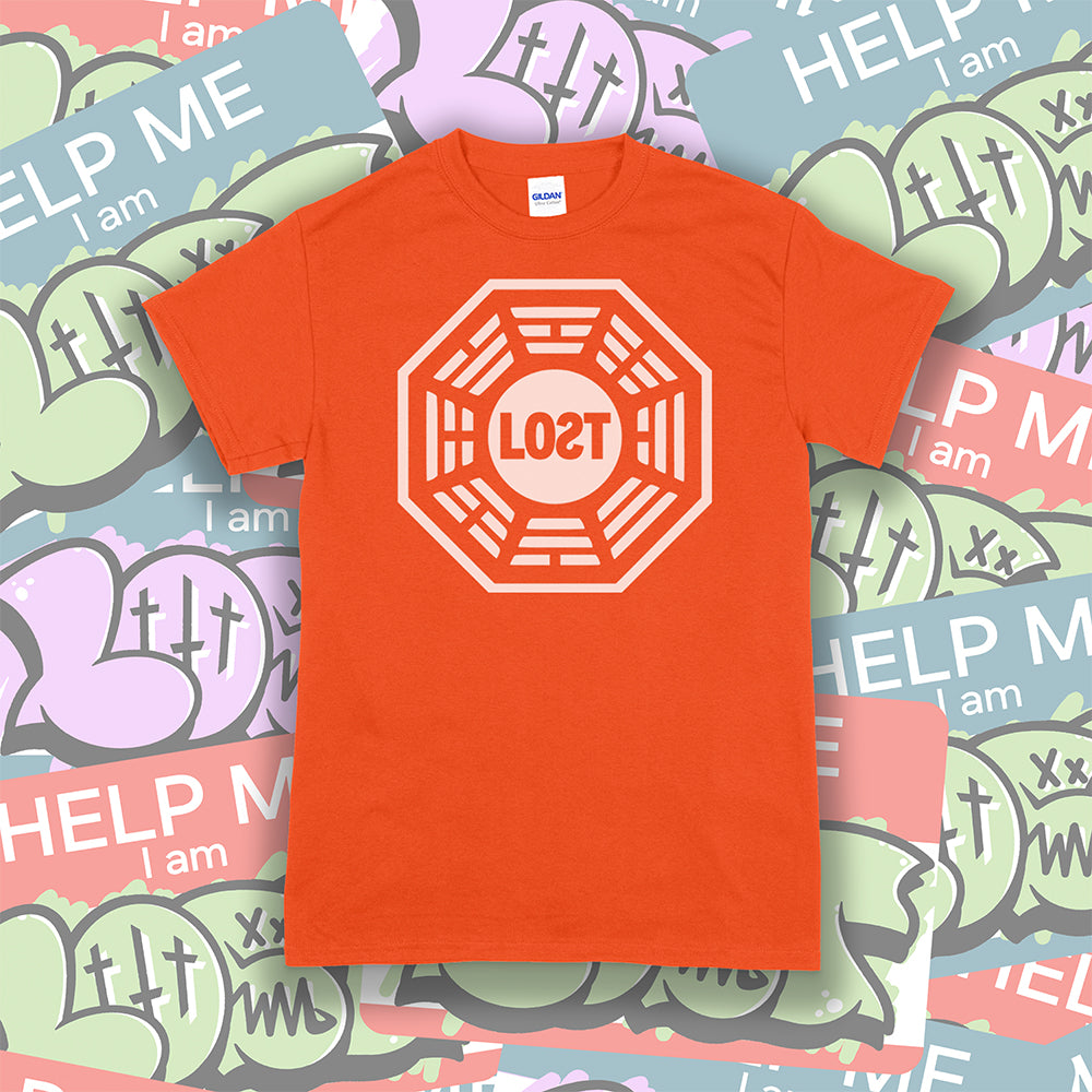 The Lost Initiative t-shirt with a large solid white logo screen printed on a bright orange shirt. A collection of colorful LOST graffiti stickers make up the background.
