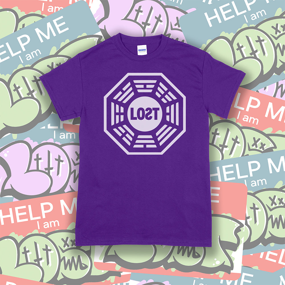 The Lost Initiative t-shirt with a large solid white logo screen printed on a purple shirt. A collection of colorful LOST graffiti stickers make up the background.